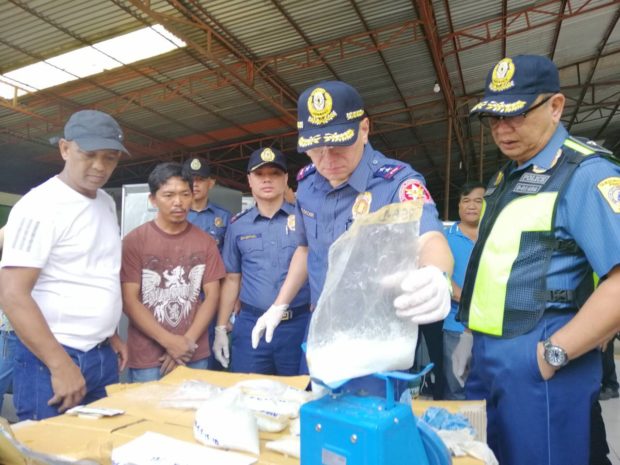 NCRPO Chief Police Director General Guillermo Eleazar inspects the P40.8 million worth of suspected shabu recovered in front of a repair service building in Barangay Fairview, Quezon City on Thursday, September 13, 2018. (Photo from NCRPO)