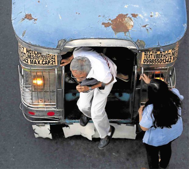 HARDSHIP RIDE Commuters would soon add increased jeepney fare to their daily woes on top of heavy traffic and pollution.—RICHARD A. REYES