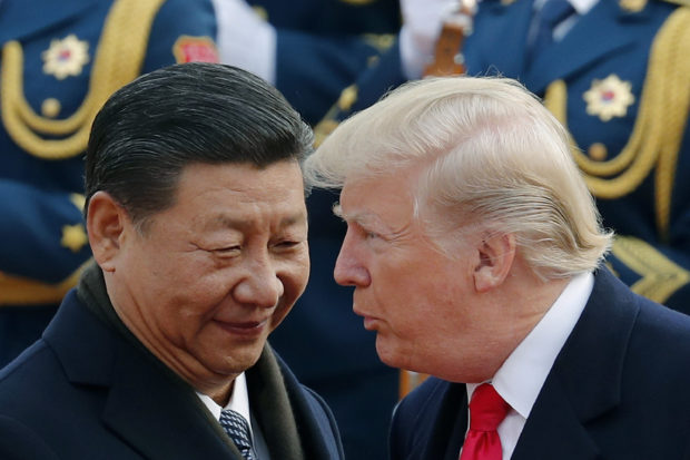 Amid trade war, China's Xi talks up economy