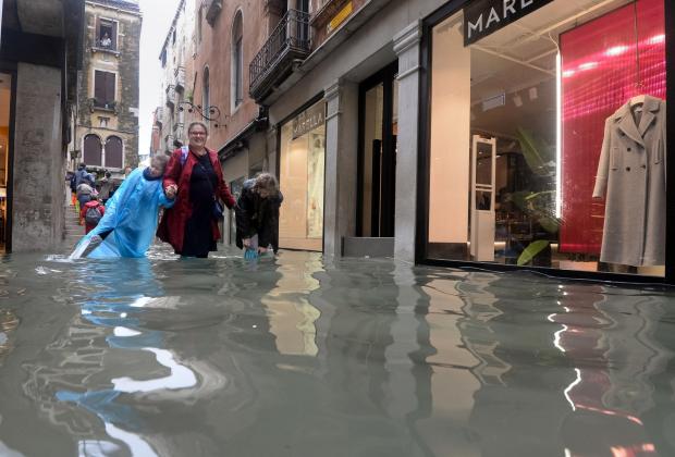People walk in crowed Venice street