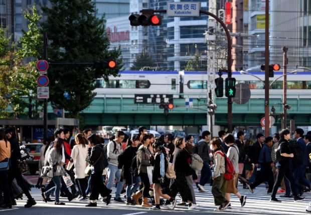 Labor woes force Japan to prise open door to migrant workers