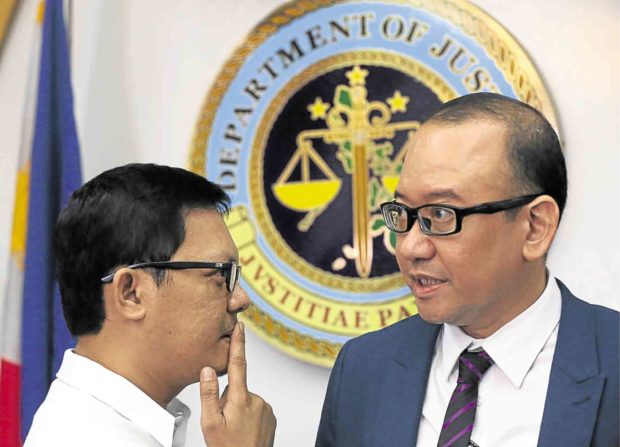HEYDAYAl Argosino (right) and Michael Robles (left) at the Bureau of Immigration in December 2016 during a press conference to deny extorting P50 million from gambling financier Jack Lam. —INQUIRER PHOTO