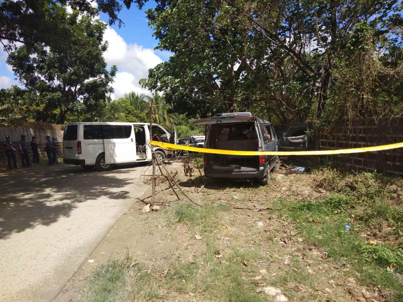 CRIME SCENE: Three alleged contract killers were killed in a shootout after refusing to stop at a police checkpoint in Taysan, Batangas. (Gray van was suspects’ vehicle). Photos from Batangas PNP