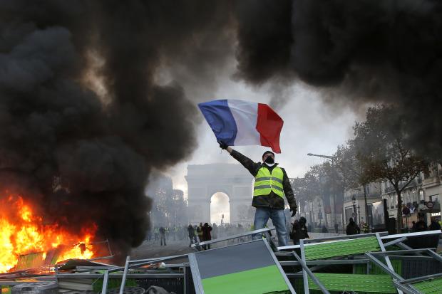 Demonstrator waving French flag