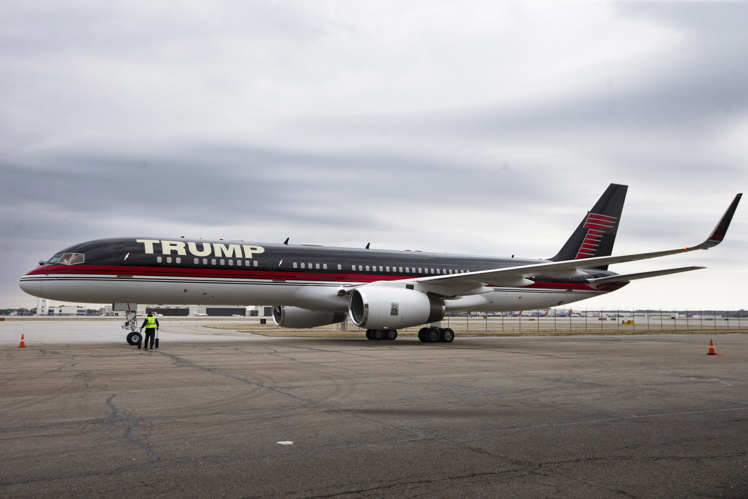 FILE - In this March 1, 2016 file photo, Republican presidential candidate Donald Trump's private jet arrives at Port-Columbus International Airport, in Columbus, Ohio. President Donald Trump's private jet, an instantly recognizable Boeing 757 used during his campaign, was caught up in a quintessential New York City traffic mishap at LaGuardia Airport on Wednesday, Nov. 28, 2018: a fender bender while someone else was trying to park. A corporate jet maneuvering into a parking spot clipped the wing of Trump's parked plane around 8:30 a.m., Trump's company, The Trump Organization, confirmed. (AP Photo/John Minchillo, File)