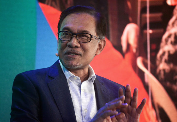 Malaysian politician Anwar Ibrahim speaks at the Bloomberg New Economy Forum in Singapore, on Nov. 6, 2018. AP