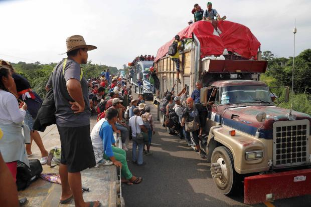 Central American migrants on trucks