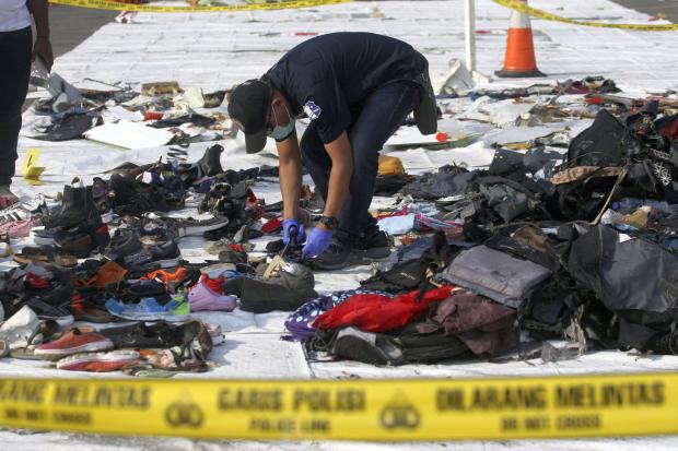 Investigator inspects debris from Lion Air flight JT610