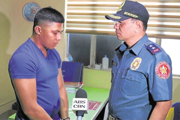 REMORSE AFTER THE DEED NCRPO chief, Director Guillermo Eleazar, confronts PO1 Carlos Alberato Aljama  (left) after the in-camp shooting which left another rookie policeman, PO1 Mark Carlo Pasamba, dead. —NCRPO PHOTO