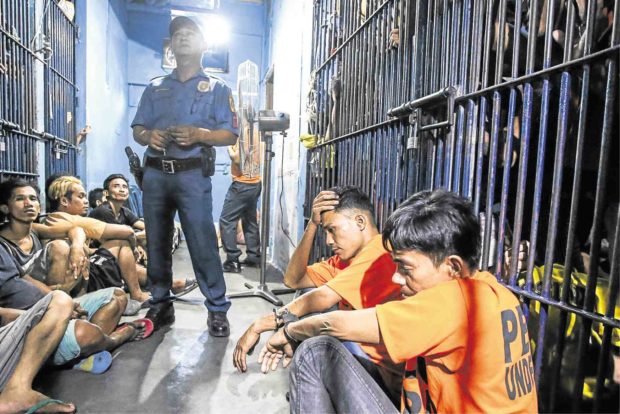 NOTORIOUS A look inside Station 6, Batasan Police Station shows an overcrowded jail where drug suspects are packed. —JAM STA. ROSA