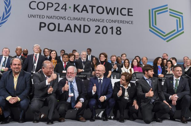 States agree on landmark, but weak, global climate pact rules