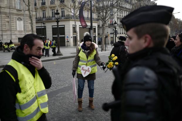 Yellow vest protesters talk with cops
