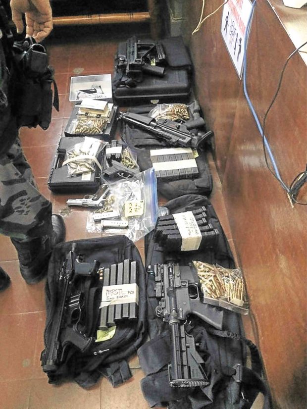 FIREPOWER Two assault rifles and two machine pistols were among the weapons Iloilo Rep. Richard Garin Jr. and his father, Guimbal Mayor Oca Garin, were forced to surrender to the police, along with assorted ammunition, after the PNP canceled all their licenses to possess and carry firearms. —CONTRIBUTED PHOTO