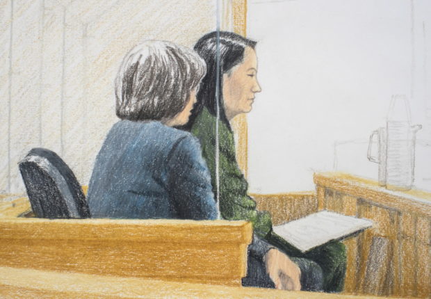 In this courtroom sketch, Meng Wanzhou, right, the chief financial officer of Huawei Technologies, sits beside a translator during a bail hearing at British Columbia Supreme Court in Vancouver, on Friday, Dec.  7, 2018.  Meng faces extradition to the U.S. on charges of trying to evade U.S. sanctions on Iran. She appeared in a Vancouver court Friday to seek bail.  (Jane Wolsak/The Canadian Press via AP)