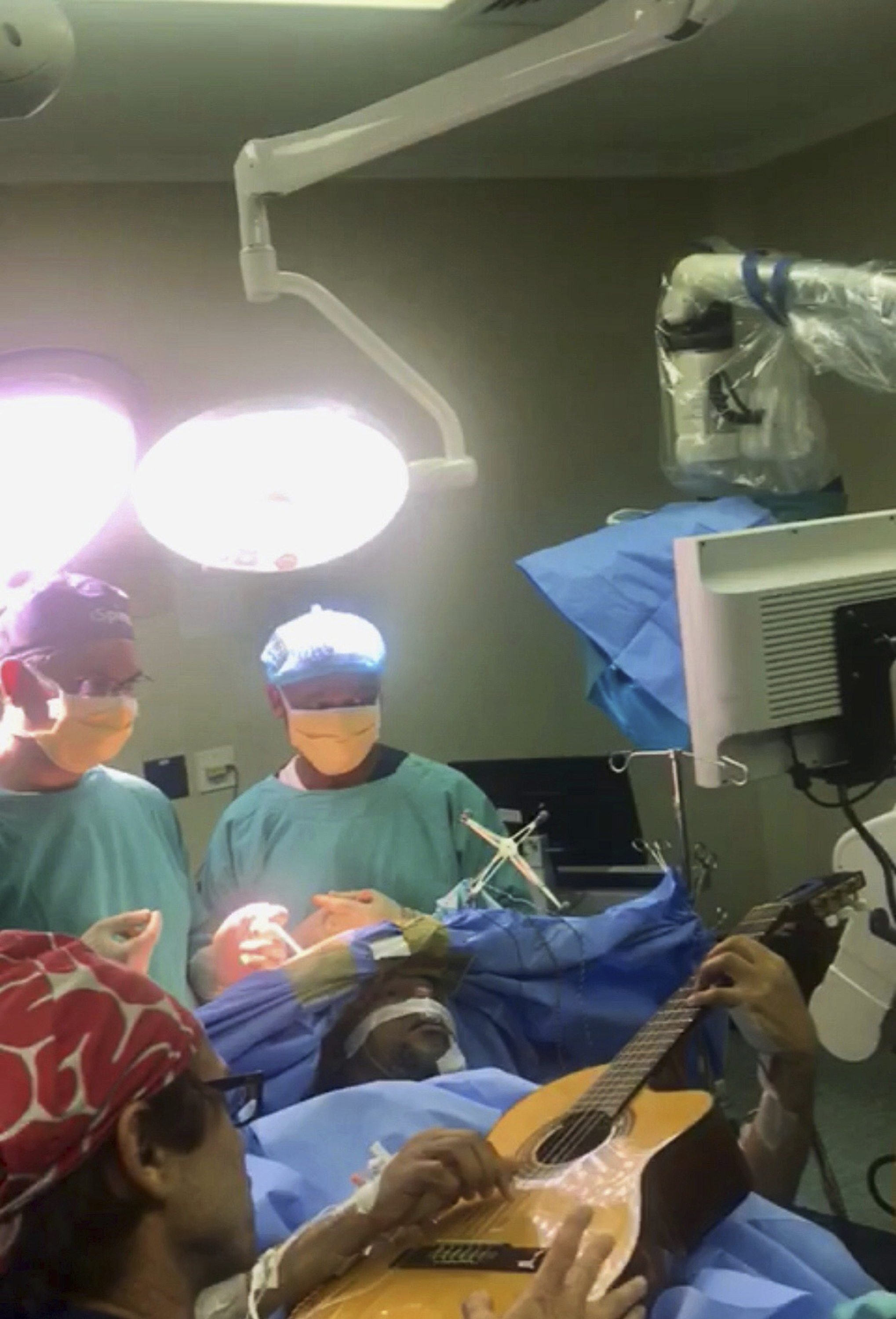 South African musician plays guitar during brain surgery