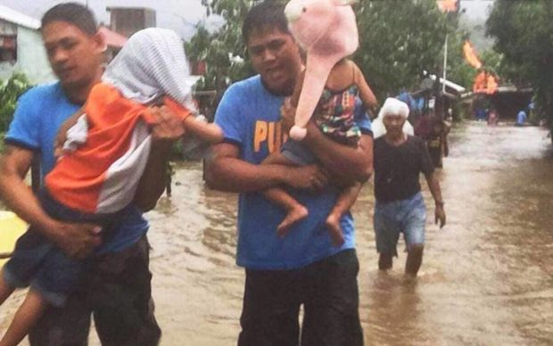 LOOK: Rescuers brave flooding for stranded persons in Bicol