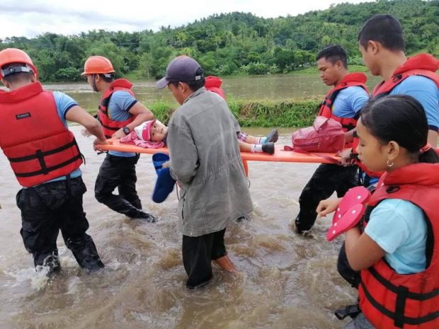 LOOK: Rescuers brave flooding for stranded persons in Bicol