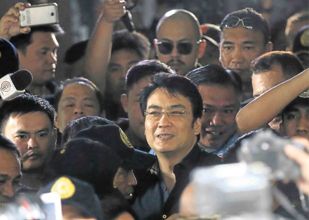 NOT GUILTY Former Sen. Ramon “Bong” Revilla Jr. celebrates his acquittal surrounded by supporters and media at the Sandiganbayan. LYN RILLON