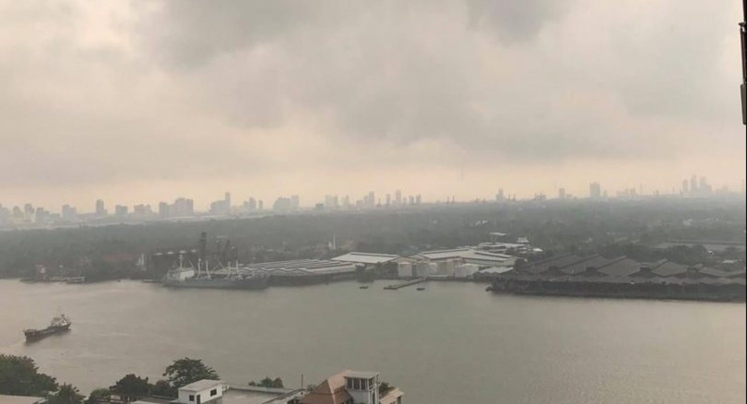 Rain makes small dent in still-unsafe Bangkok air