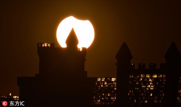The first partial solar eclipse of 2019 captured with an ice sculpture in Harbin, Northeast China's Heilongjiang province, on Sunday. IC via China Daily/Asia News Network
