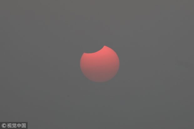 A partial solar eclipse in Beijing on Sunday morning. VCG via China Daily/Asia News Network