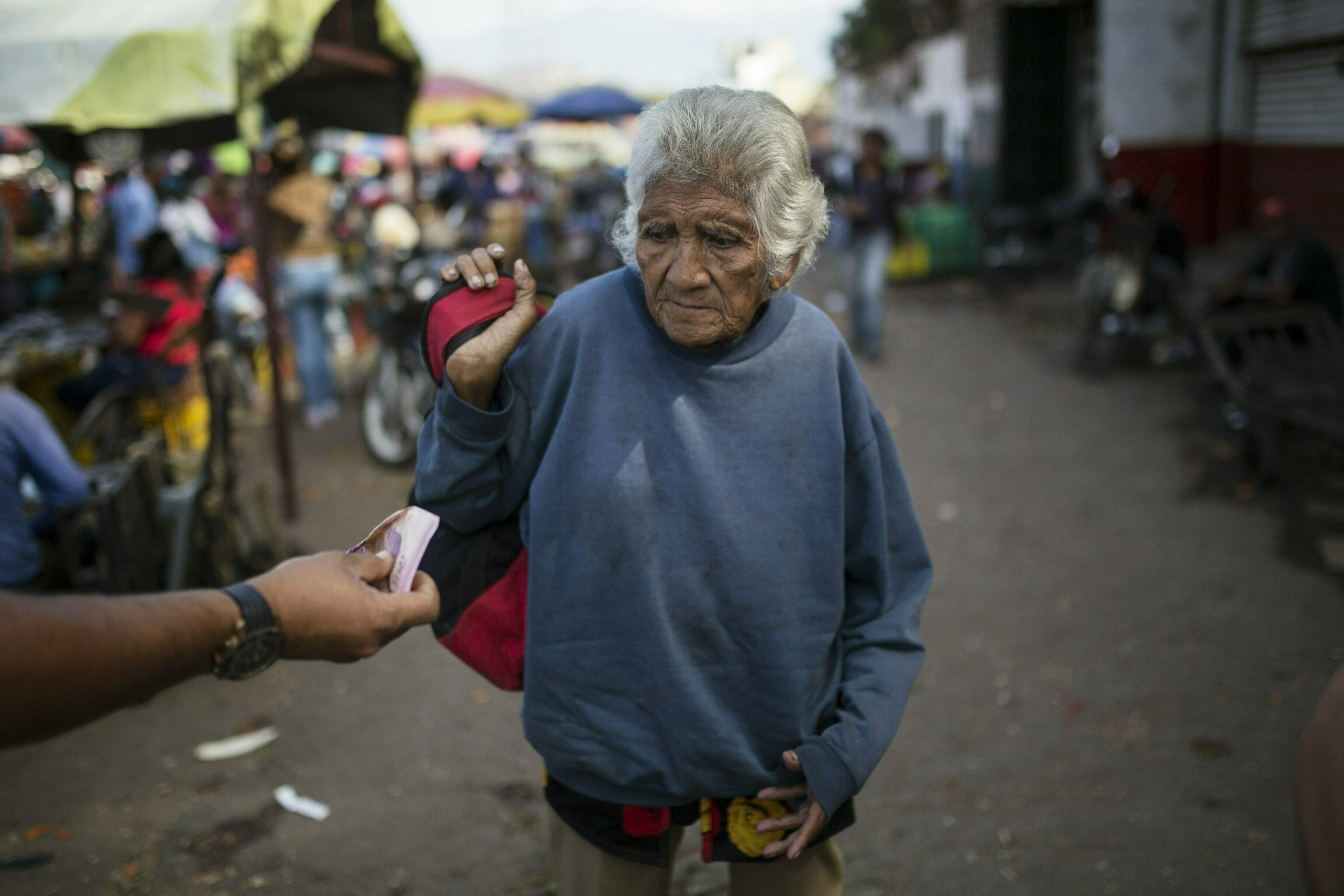 Presidential standoff may worsen Venezuelans' misery