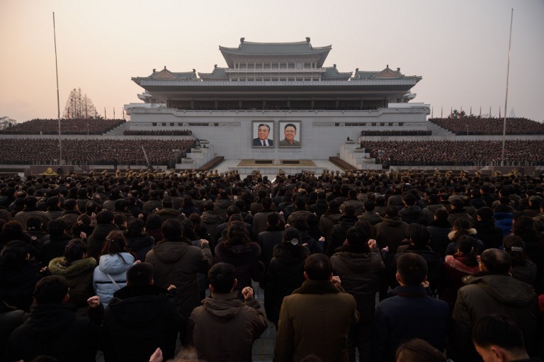 People shout slogans as they attend a rally in support of a new year's address by North Korean leader Kim Jong Un, at Kim Il Sung square in Pyongyang on January 4, 2019. - Much of Kim's January 1 speech focused on North Korea's moribund economy, saying that improving people's lives was his top priority and tackling energy shortages was an urgent task. (Photo by KIM Won Jin / AFP)