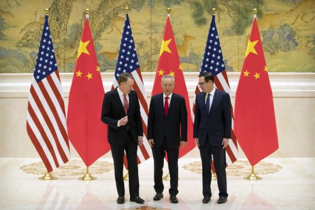 (From L) US Trade Representative Robert Lighthizer, Chinese Vice Premier and lead trade negotiator Liu He and US Treasury Secretary Steven Mnuchin talk before the opening session of trade negotiations at the Diaoyutai State Guesthouse in Beijing on February 14, 2019. - US and Chinese negotiators kicked off two days of official trade talks in Beijing on February 14 as the world's top two economies try to patch up their festering economic dispute. (Photo by Mark Schiefelbein / POOL / AFP)