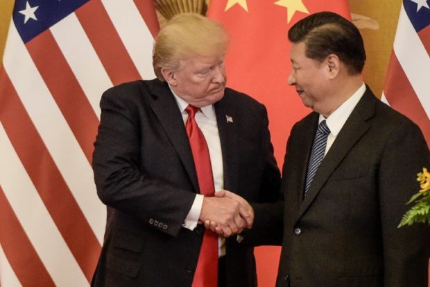 US President Donald Trump (L) shakes hand with China's President Xi Jinping at the end of a press conference at the Great Hall of the People in Beijing on November 9, 2017. - Donald Trump and Xi Jinping put their professed friendship to the test on November 9 as the least popular US president in decades and the newly empowered Chinese leader met for tough talks on trade and North Korea. (Photo by Fred DUFOUR / AFP)