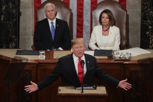 WASHINGTON, DC - FEBRUARY 05: President Donald Trump, with Speaker Nancy Pelosi and Vice President Mike Pence looking on, delivers the State of the Union address in the chamber of the U.S. House of Representatives at the U.S. Capitol Building on February 5, 2019 in Washington, DC. President Trump's second State of the Union address was postponed one week due to the partial government shutdown. Chip Somodevilla/Getty Images/AFP