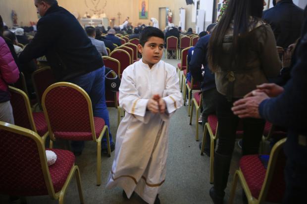 Altar boy in Orthodox church in Iraq
