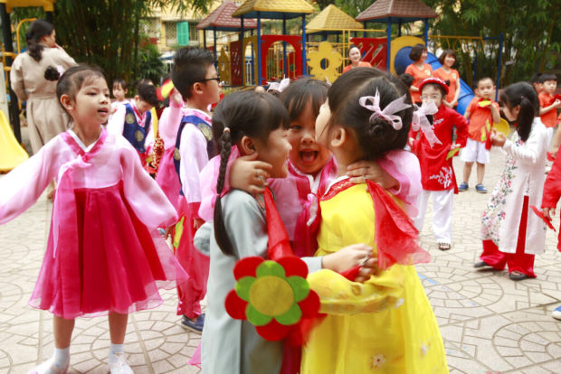 Hanoi Postcard: Children hope to give Kim comradely welcome