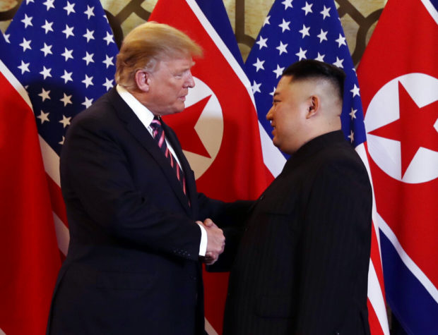 Trump, Kim share handshakes, laughs, small talk