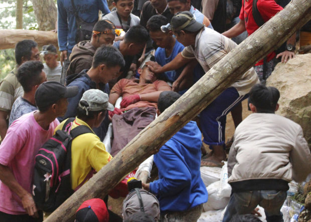 Deaths from Indonesia mine collapse rise to 6, dozens buried
