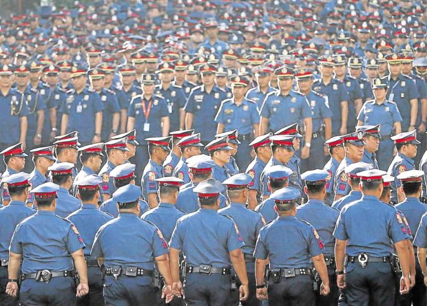 PNP officers in formation. STORY: Hushed probe of police generals under way