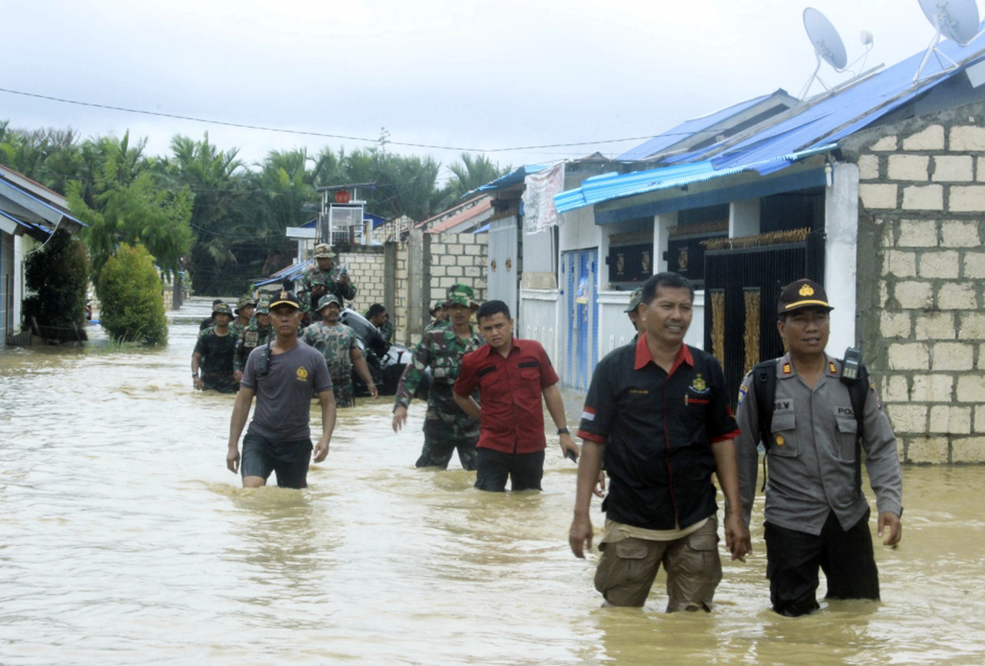 Flash floods, earthquake in Indonesia kill at least 79