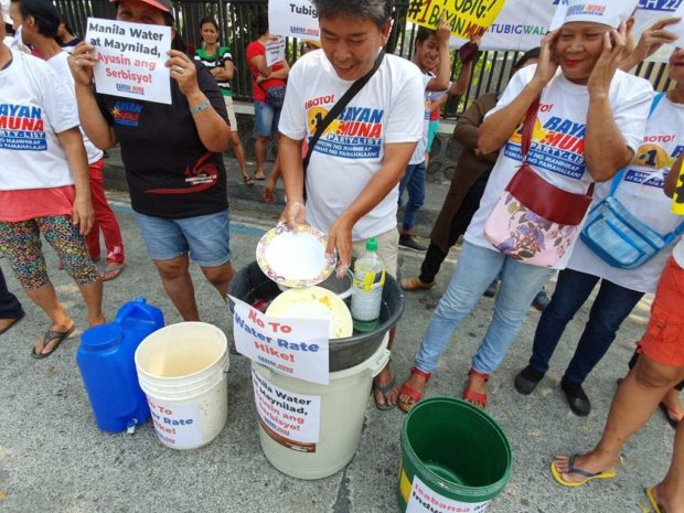 LOOK: Bayan Muna slams Manila Water for service interruptions