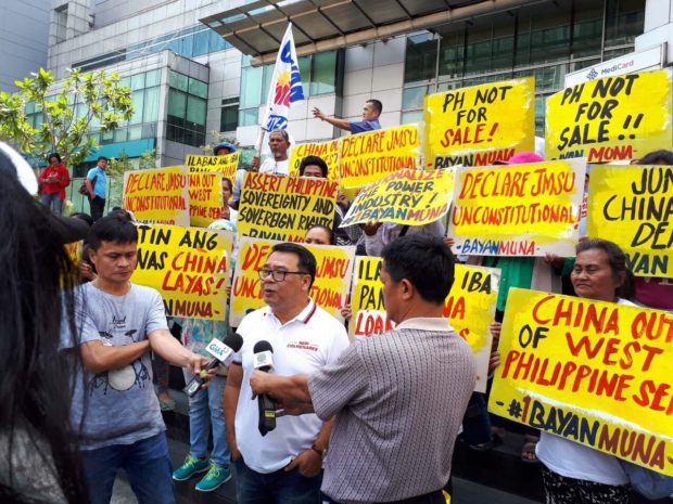 LOOK: Bayan Muna protests China loans outside Chinese embassy