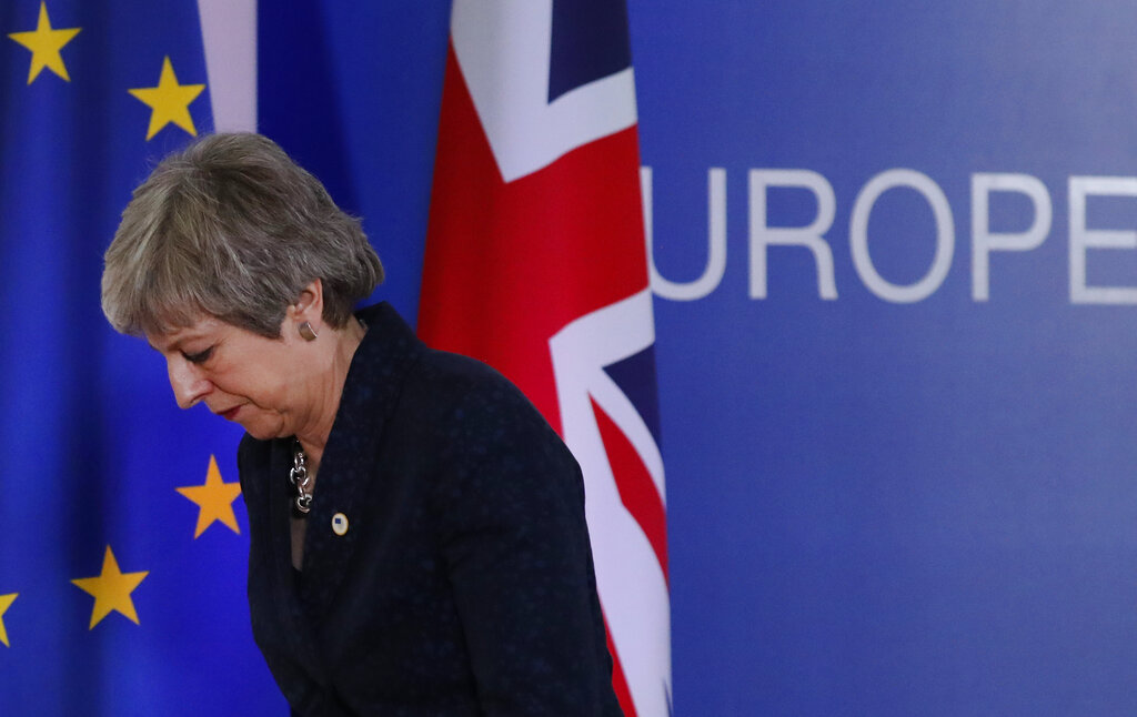 UK PM May faces heavy pressure to step down to save Brexit