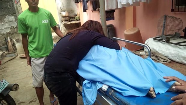 Rovelyn Uy, 28, weeps over her child who was fatally stabbed in Mobo, Masbate. PHOTO FROM Police Regional Office 5