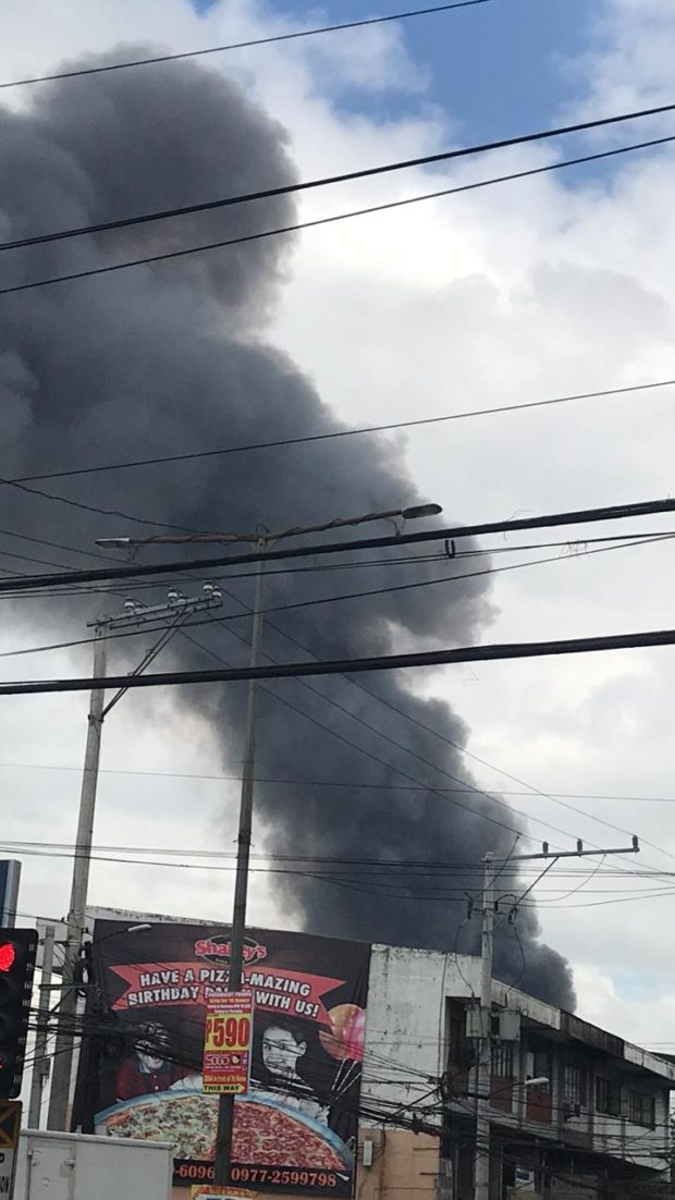 Fire engulfing residential area in QC