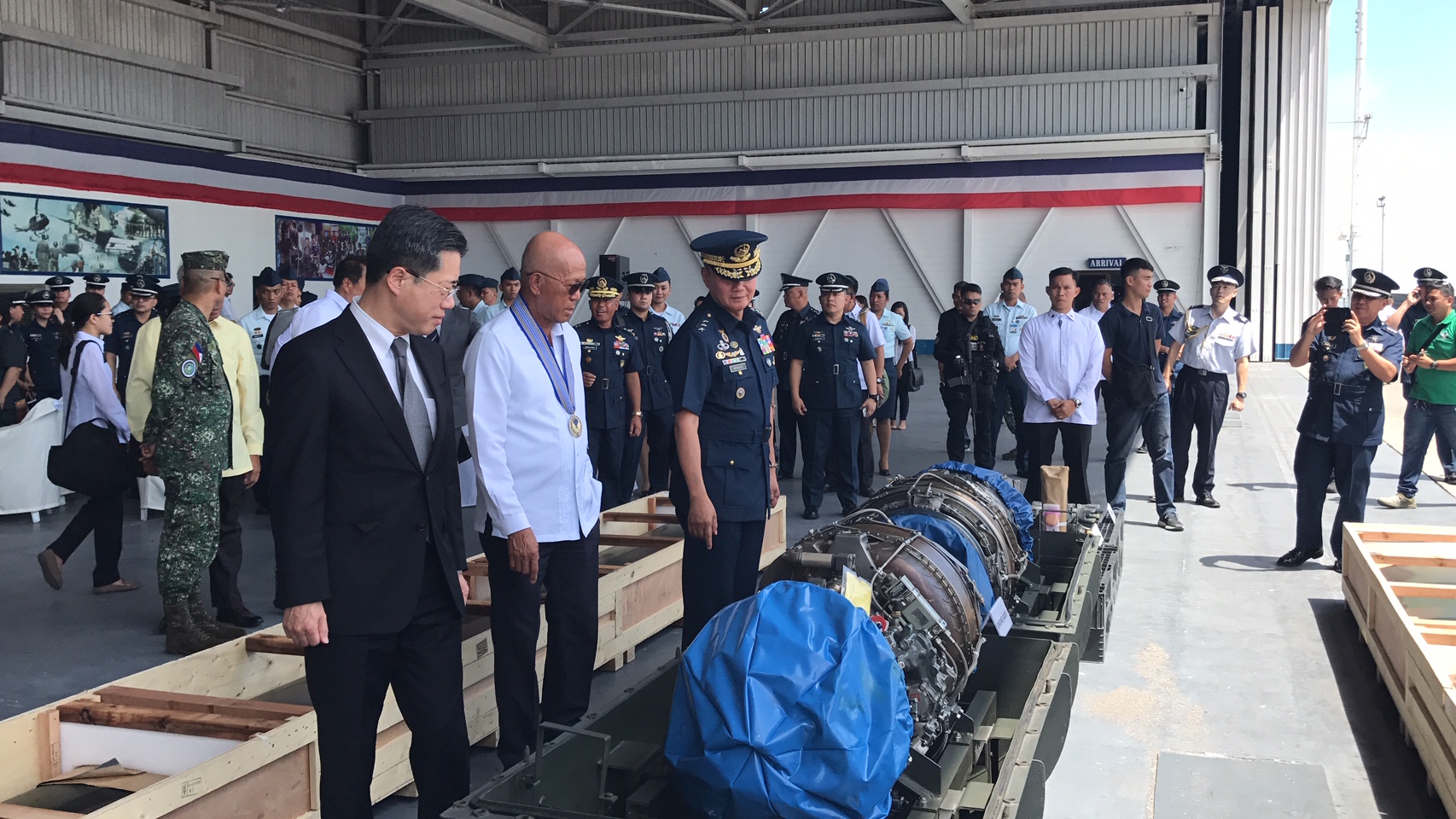 philippine air force Defense Secretary Delfin Lorenzana leads the inspection of the spare parts donated by Japan. A turnover ceremony for the first batch of the items was held on Tuesday at Clark Air Base. FRANCES MANGOSING, INQUIRER.net