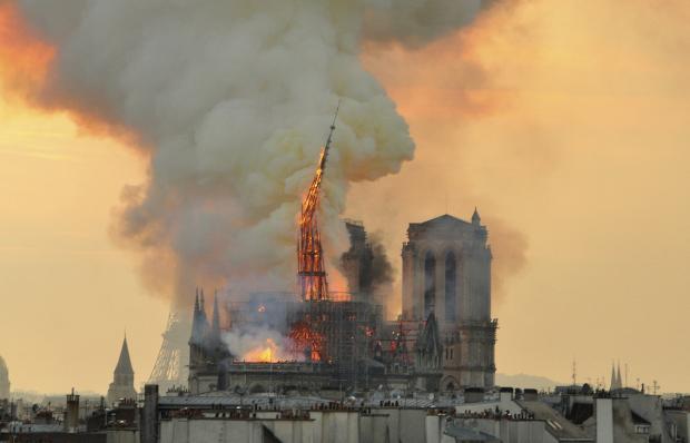 Spire of Notre Dame Cathedral starts to topple