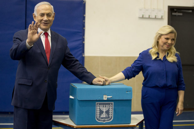 Israeli exit polls show Netanyahu edging ahead of rival