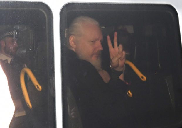 WikiLeaks' Assange hauled from embassy, faces US charge