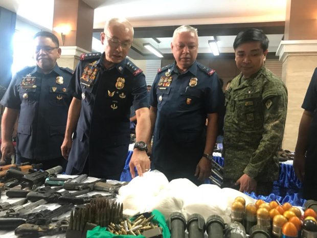 High-powered firearms and explosives surrendered by former NPA rebels in Calabarzon