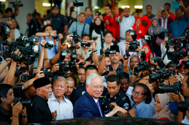 Prosecutor says ex-Malaysian PM abused his 'absolute power'