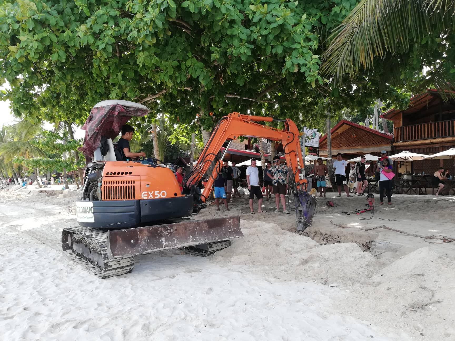 Resort owners tear down illegal structures along Alona Beach in Panglao