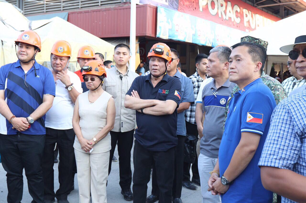 President Rodrigo Duterte and Pampanga Rep. Gloria Macapagal -Arroyo inspect the Chuzon Supermarket in Porac, Pampanga that collapsed after a magnitude 6.1 earthquake hit parts of Luzon on April 22, 2019. Photo from former SAP Bong Go