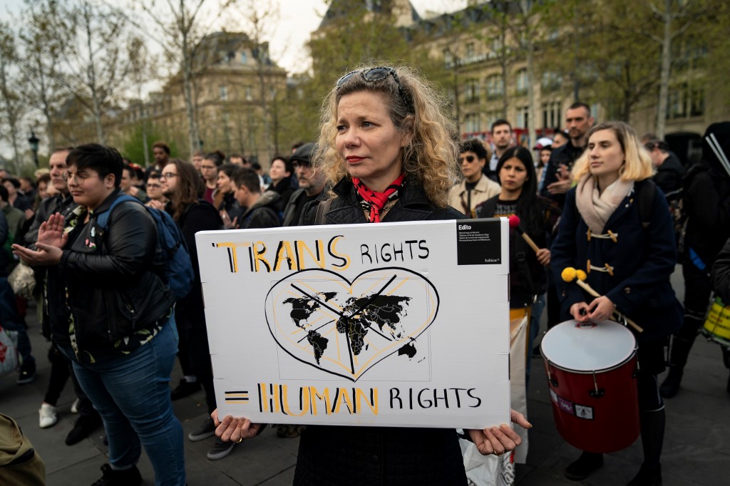 People attend a demonstration to support transgender and intersex rights and protest against discrimination in Paris on April 9, 2019. (Photo by Lionel BONAVENTURE / AFP)